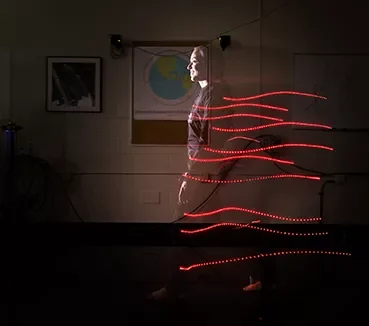 light tracking technology beams coming off a person