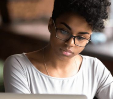 student looking at laptop screen