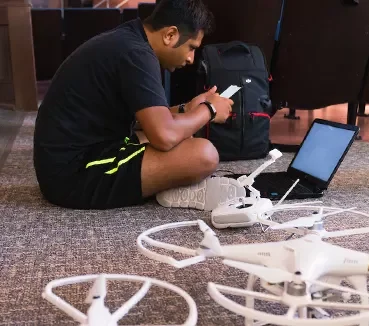 cards-online-drones student working on drones