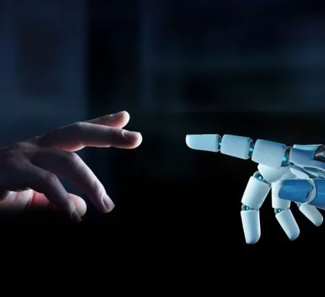 A human hand reaching out for a robot hand.