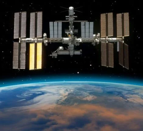 The ISS orbits above the Earth.