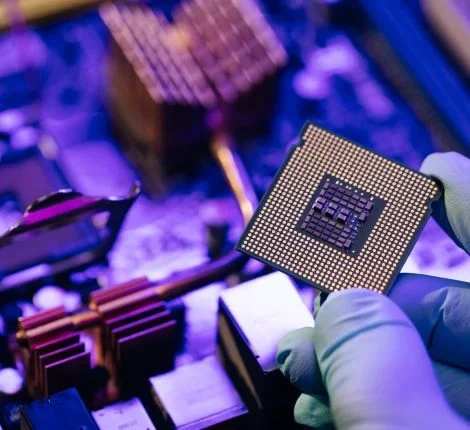 A microchip held up to the light.
