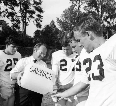 Dr. Cade gives players Gatorade