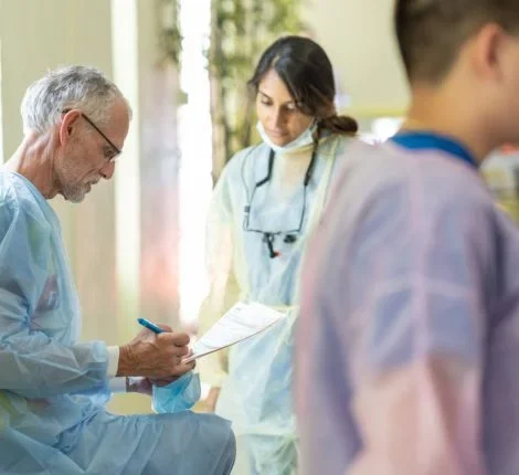 Doctors talking in the distance.