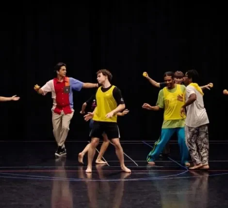 Student dancers on a black box stage