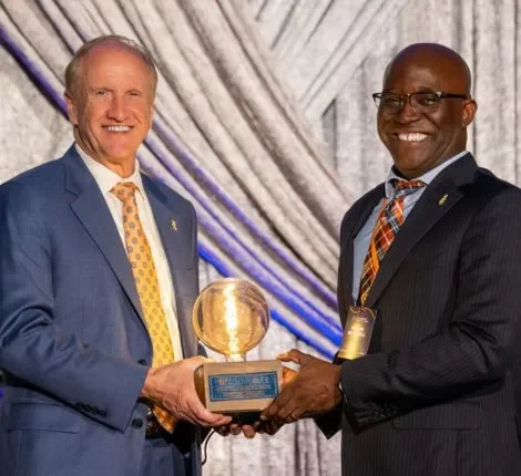 UF Innovate UF's President Bell presents an award