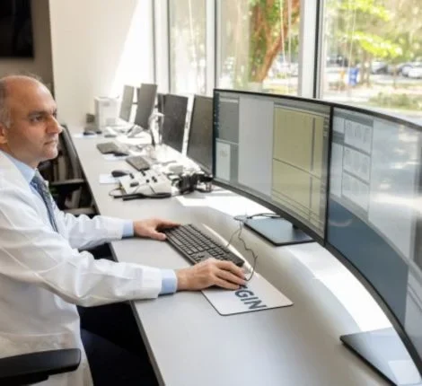fixel a doctor sits at his computer
